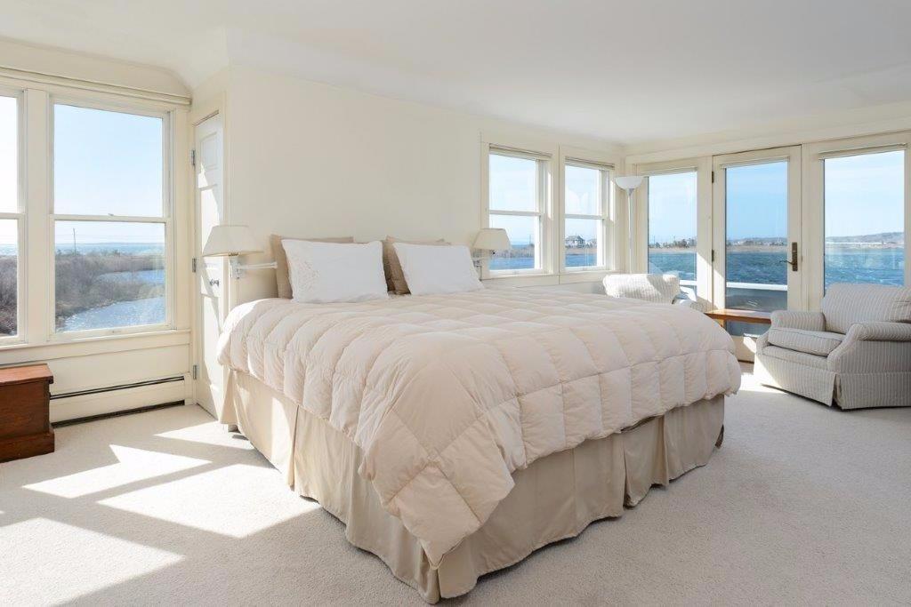333 Mill Road Falmouth, MA 02540 - Photo 15 of 28 a spacious bedroom with a bed and a large window