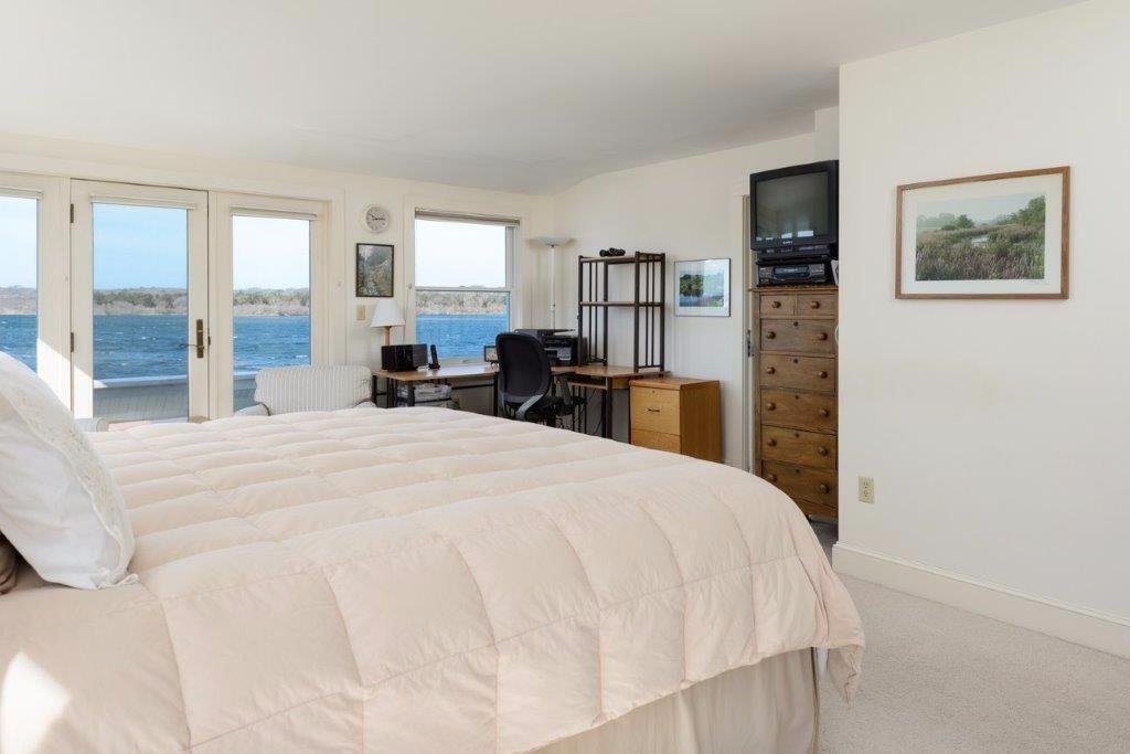 333 Mill Road Falmouth, MA 02540 - Photo 16 of 28 a bedroom with a bed and a flat screen tv