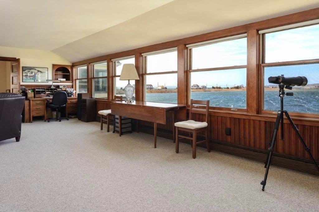 333 Mill Road Falmouth, MA 02540 - Photo 19 of 28 a bedroom with furniture and a large window