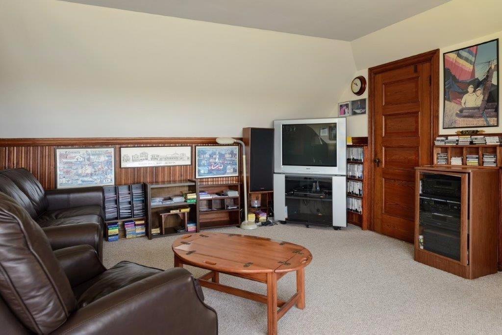333 Mill Road Falmouth, MA 02540 - Photo 20 of 28 a living room with furniture a fireplace and a flat screen tv