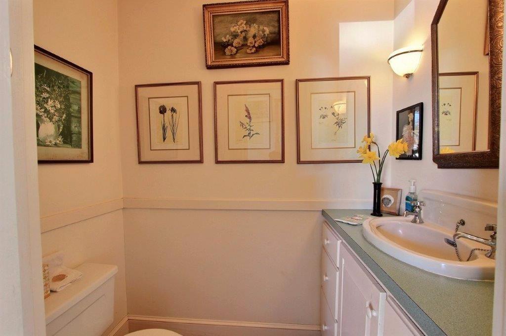 333 Mill Road Falmouth, MA 02540 - Photo 22 of 28 a bathroom with a sink and a mirror