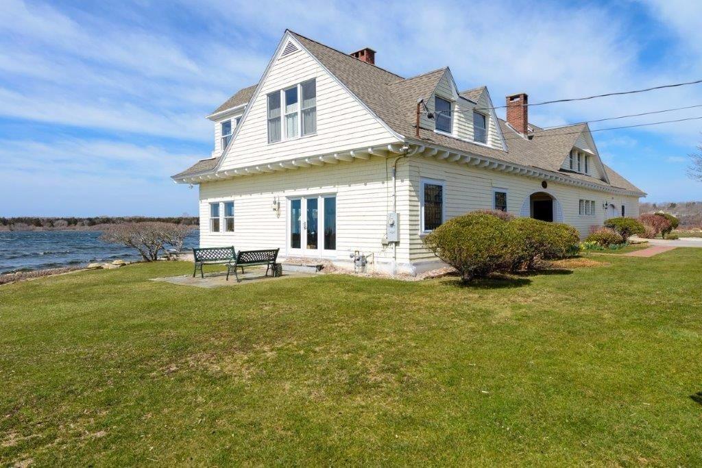 333 Mill Road Falmouth, MA 02540 - Photo 4 of 28 a front view of a house with a garden