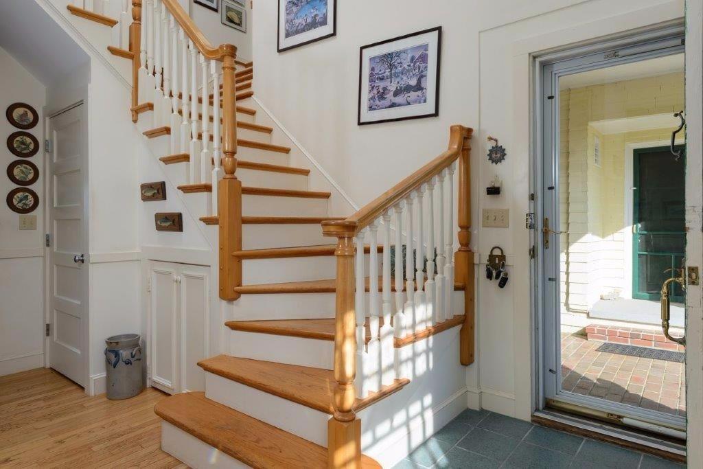333 Mill Road Falmouth, MA 02540 - Photo 6 of 28 a view of entryway with wooden floor and stairs