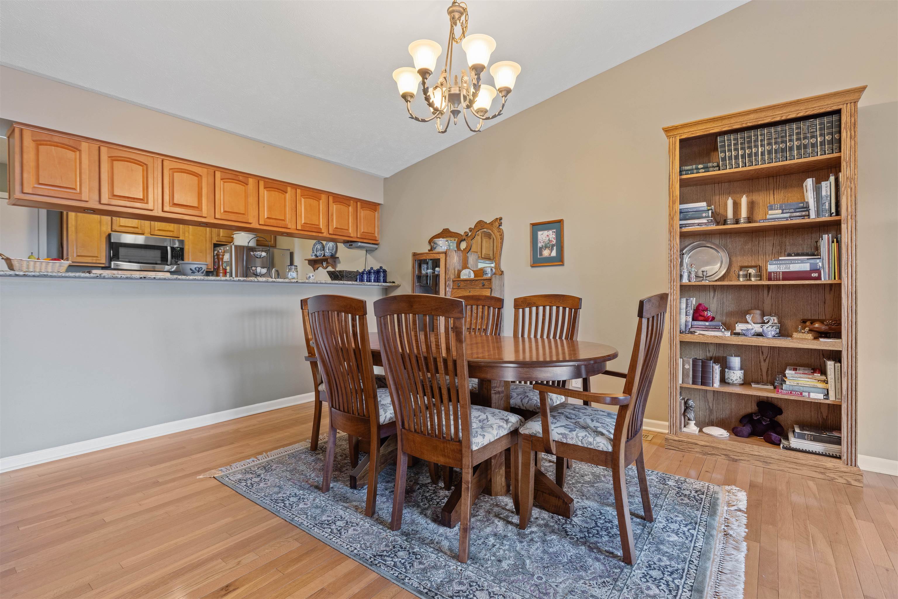 4841 Snowcap Run Loves Park, IL 61111 - Photo 5 of 18 a view of a dining room with furniture window and wooden floor