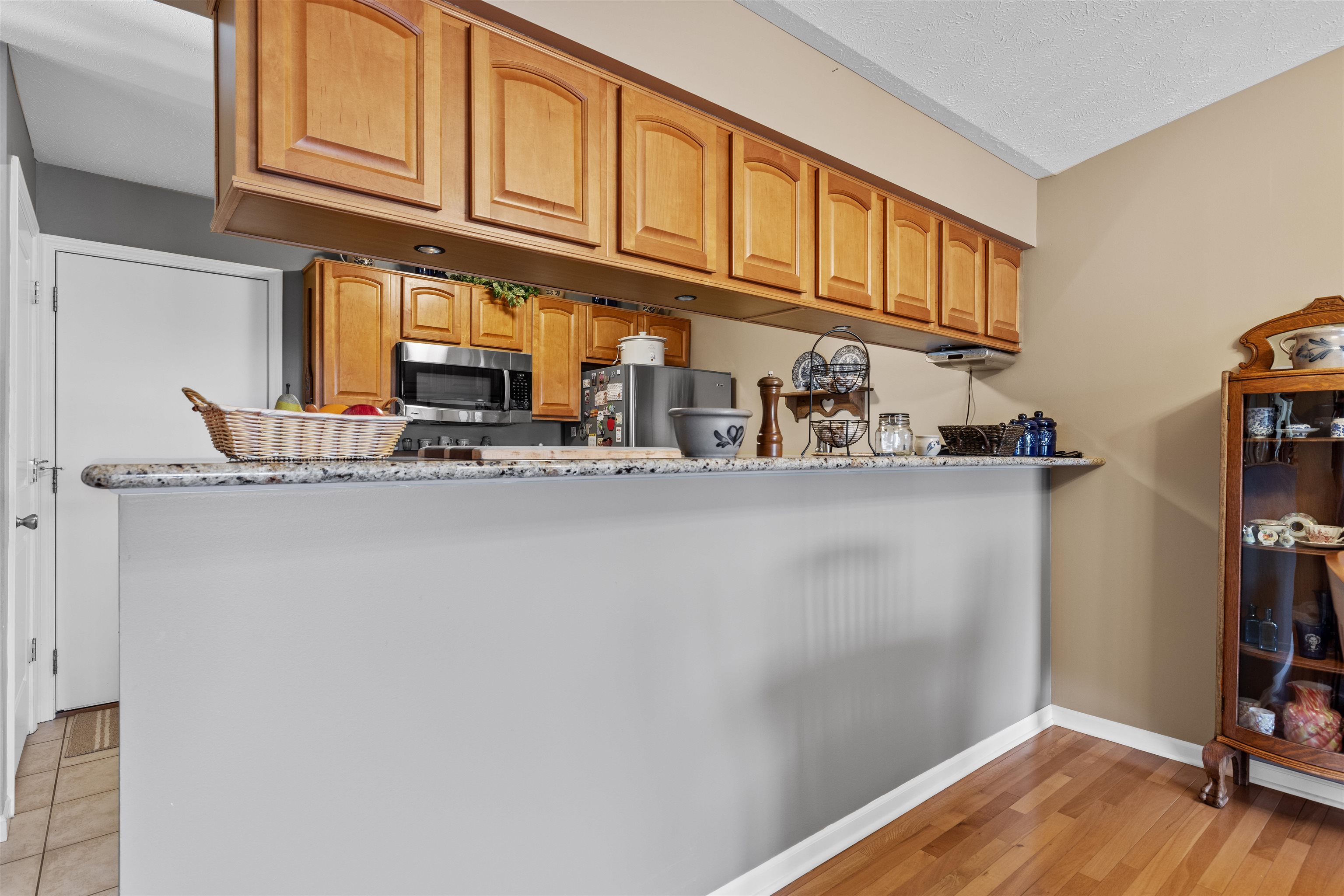 4841 Snowcap Run Loves Park, IL 61111 - Photo 8 of 18 a kitchen with stainless steel appliances granite countertop a refrigerator and cabinets