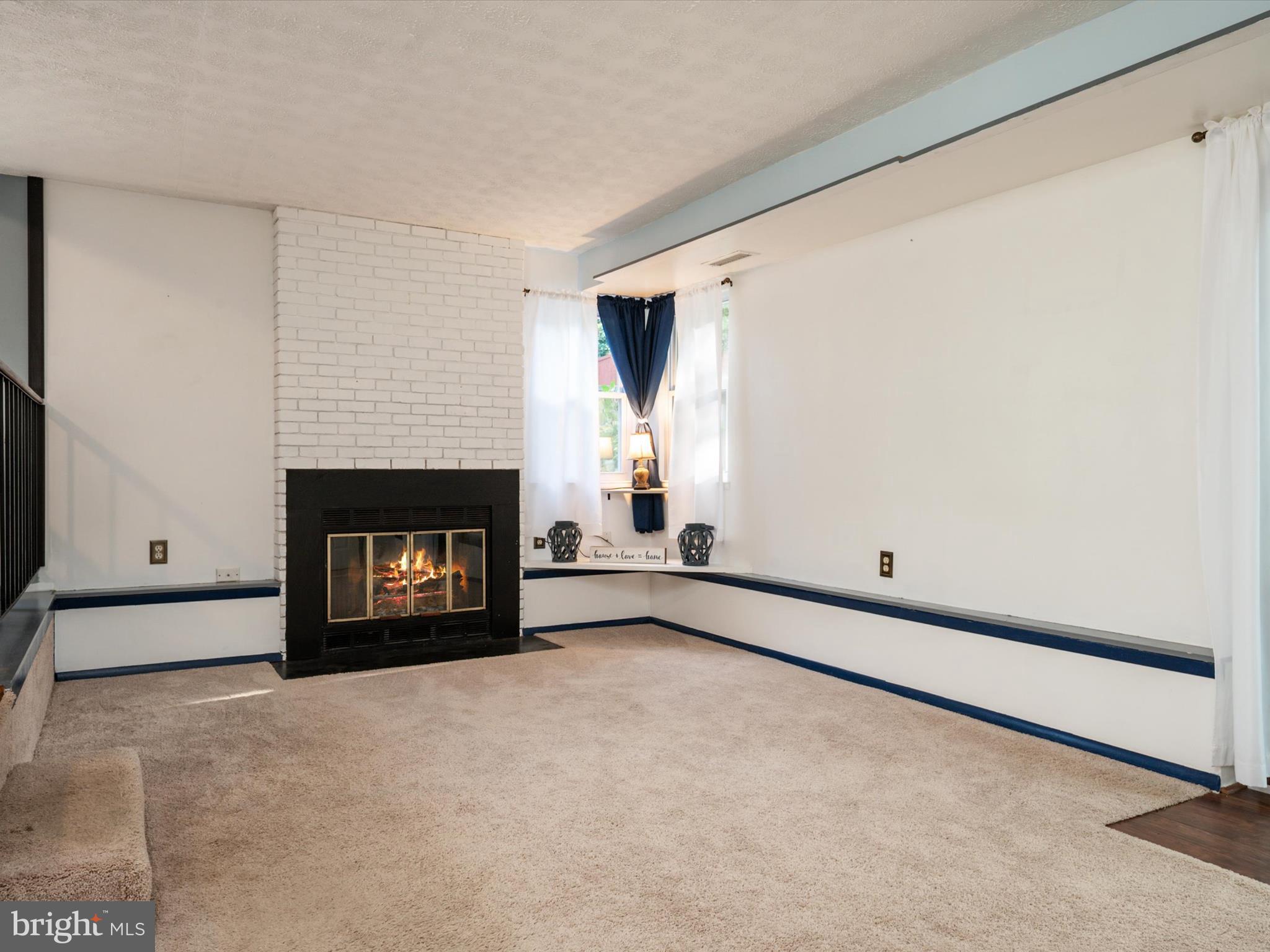 4333 Declaration Circle Belcamp, MD 21017 - Photo 20 of 37 a view of an empty room with a fireplace and a window