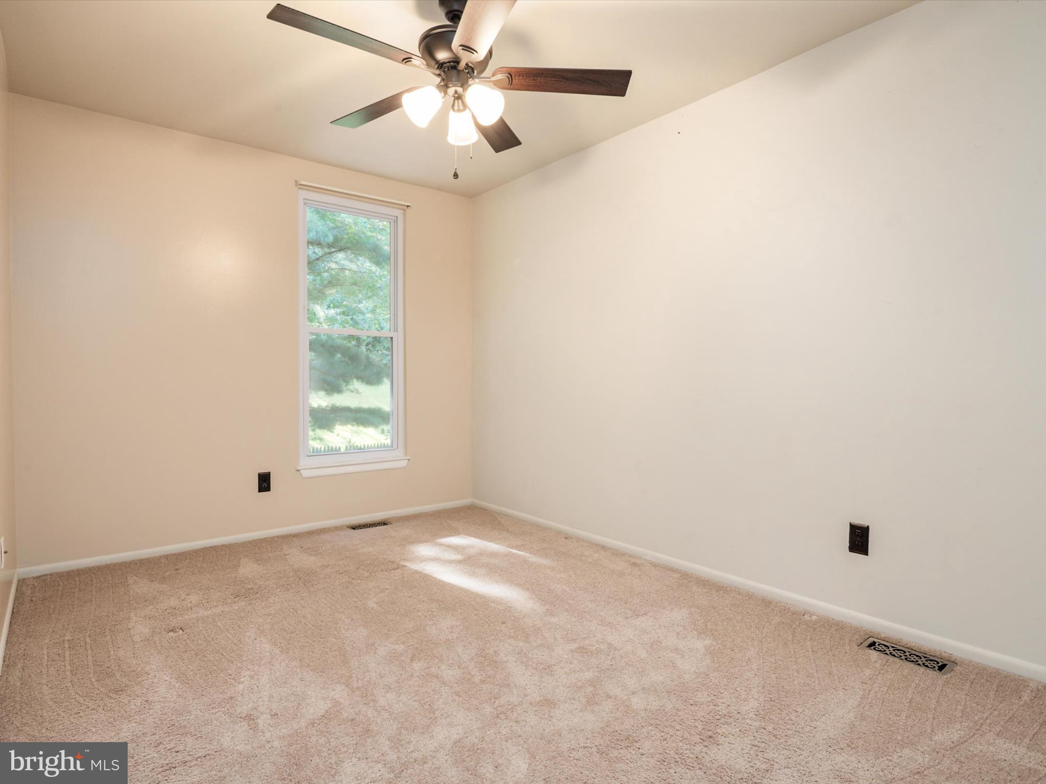 4333 Declaration Circle Belcamp, MD 21017 - Photo 27 of 37 an empty room with a window and a fan