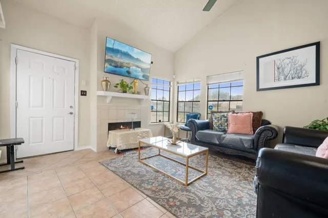 a living room with furniture and a fireplace