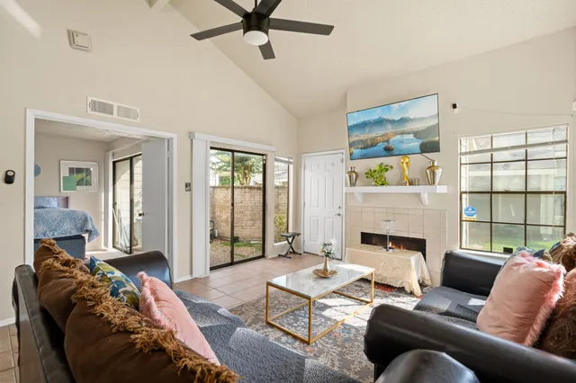 a living room with furniture and a fireplace