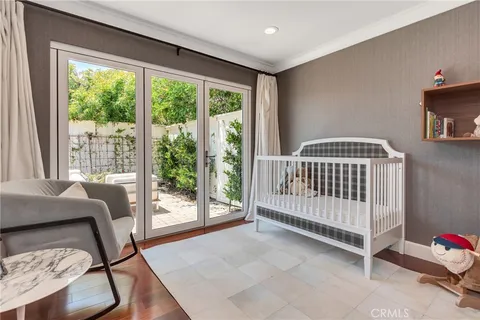 a view of a bedroom with furniture and a window