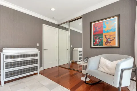 a spacious bedroom with a bed and a couch