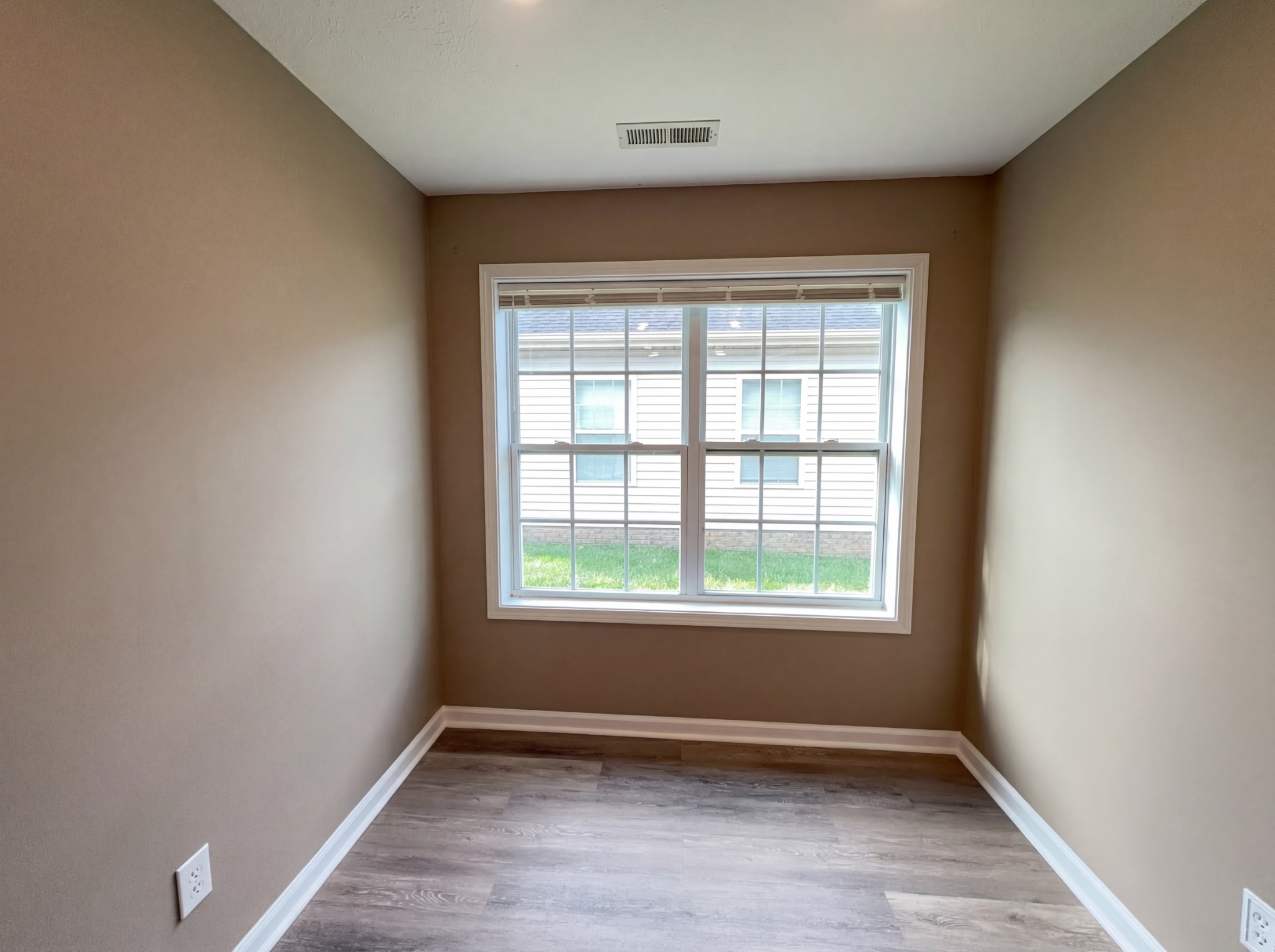 511 Bridle Way Hopkinsville, KY 42240 - Photo 13 of 17 an empty room with wooden floor and windows