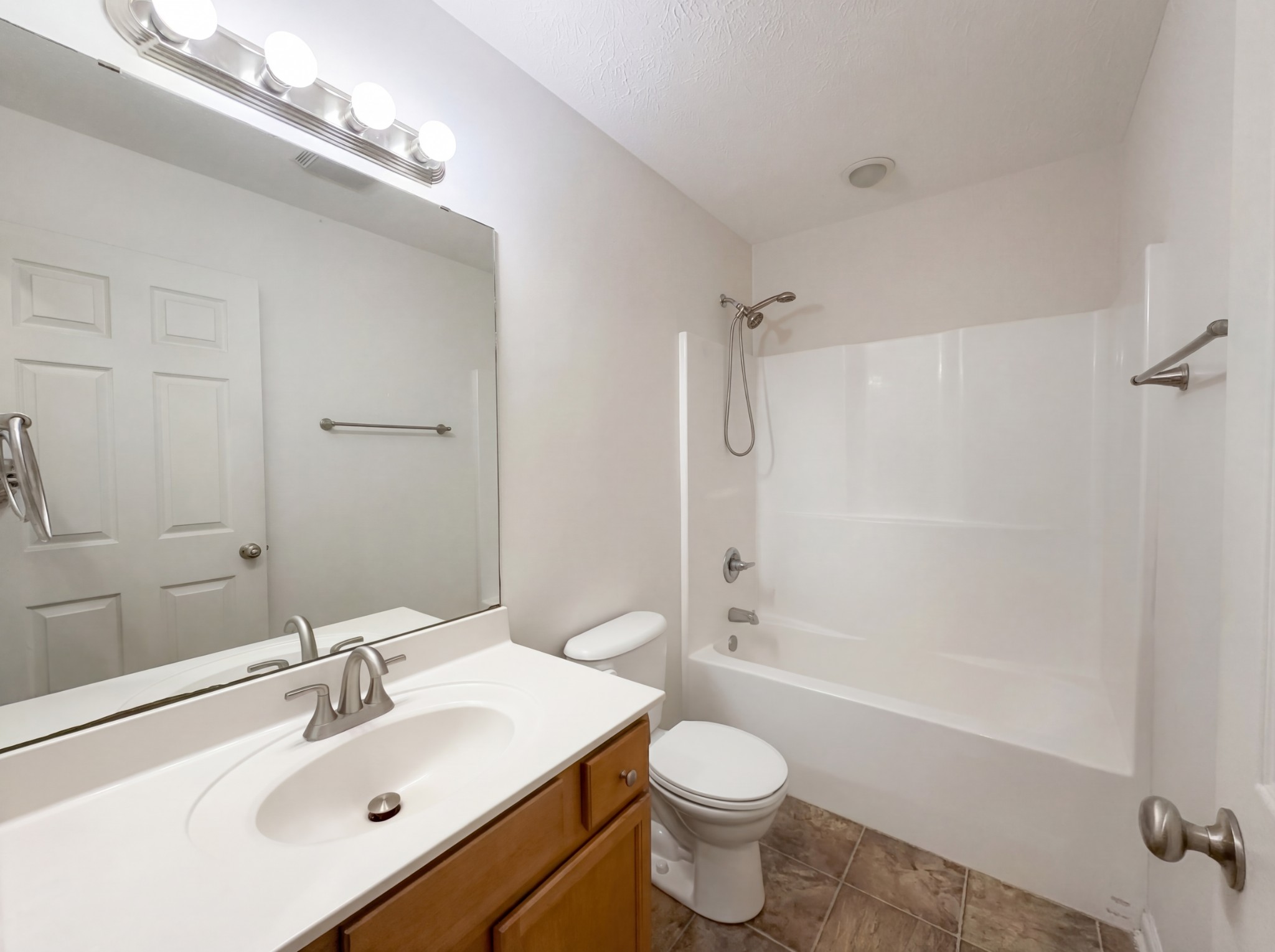 511 Bridle Way Hopkinsville, KY 42240 - Photo 6 of 17 a bathroom with a bathtub shower sink vanity mirror and toilet