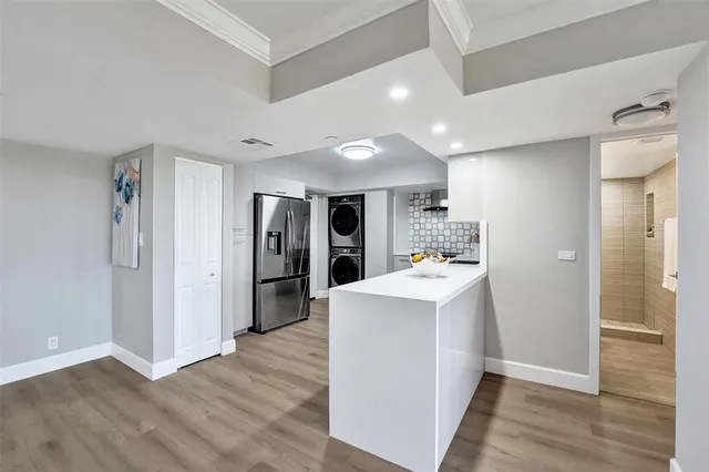 a kitchen with a sink and a stove top oven