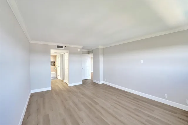 a view of a park with large trees