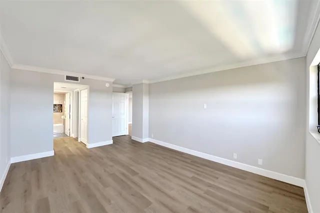 front view of a building with a garden