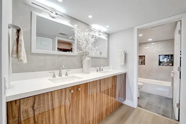 a view of a patio with table and chairs