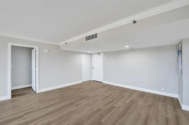 a view of kitchen with cabinets and wooden floor