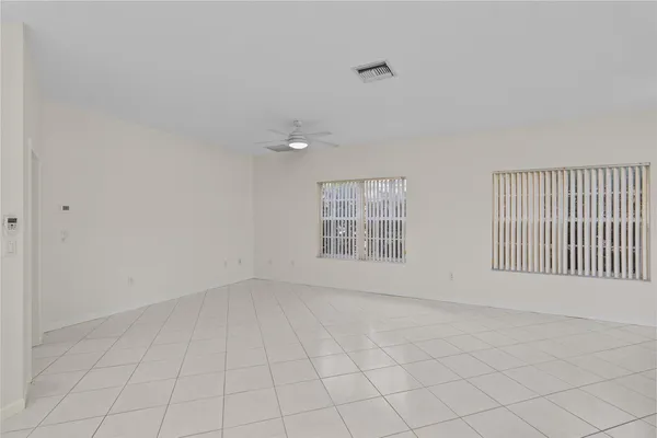 a view of a kitchen with a sink and cabinets