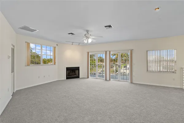 a view of a swimming pool with outdoor seating