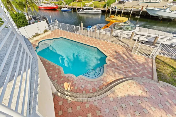 a utility room with cabinets washer and dryer