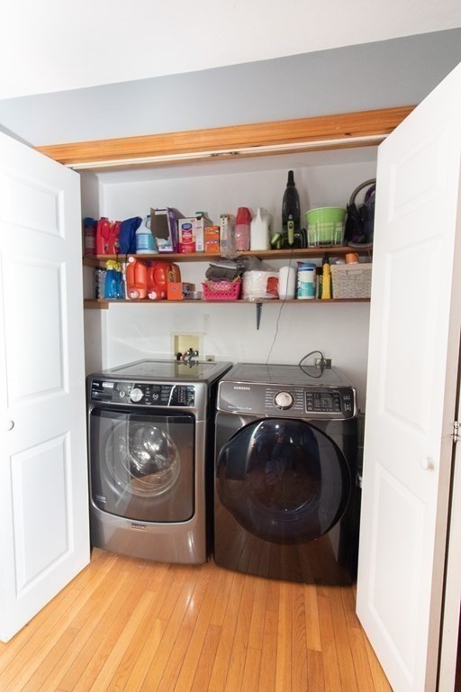 72 Bond Road Charlton, MA 01507 - Photo 11 of 36 a utility room with stainless steel appliances and wooden floor