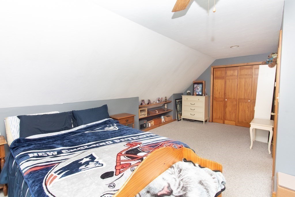 72 Bond Road Charlton, MA 01507 - Photo 13 of 36 a bedroom with a bed and wooden floor