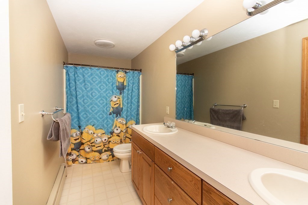 72 Bond Road Charlton, MA 01507 - Photo 21 of 36 a bathroom with a sink a large mirror and a shower