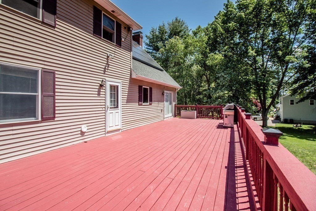 72 Bond Road Charlton, MA 01507 - Photo 27 of 36 a view of backyard with a deck and a large tree