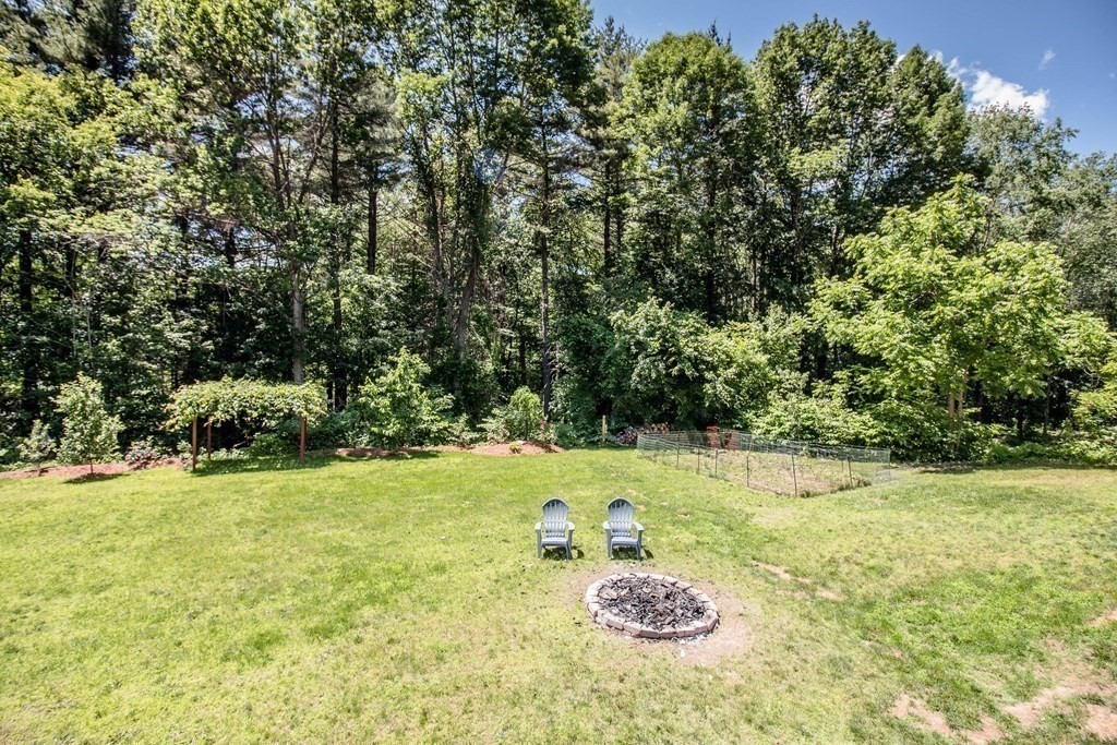 72 Bond Road Charlton, MA 01507 - Photo 29 of 36 a view of a big yard with an outdoor space