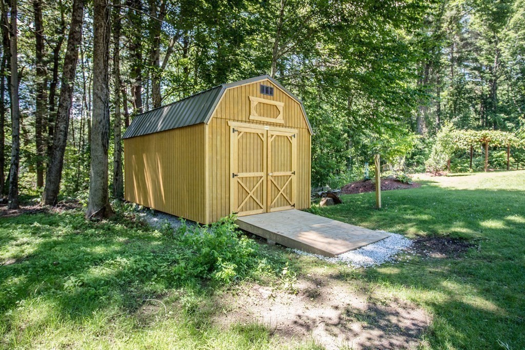 72 Bond Road Charlton, MA 01507 - Photo 31 of 36 a view of a tiny house with a yard