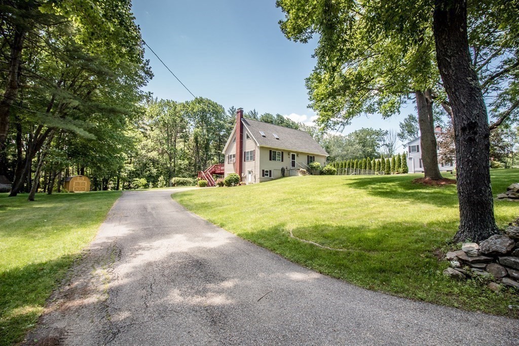 72 Bond Road Charlton, MA 01507 - Photo 34 of 36 a view of a house with a big yard and large trees