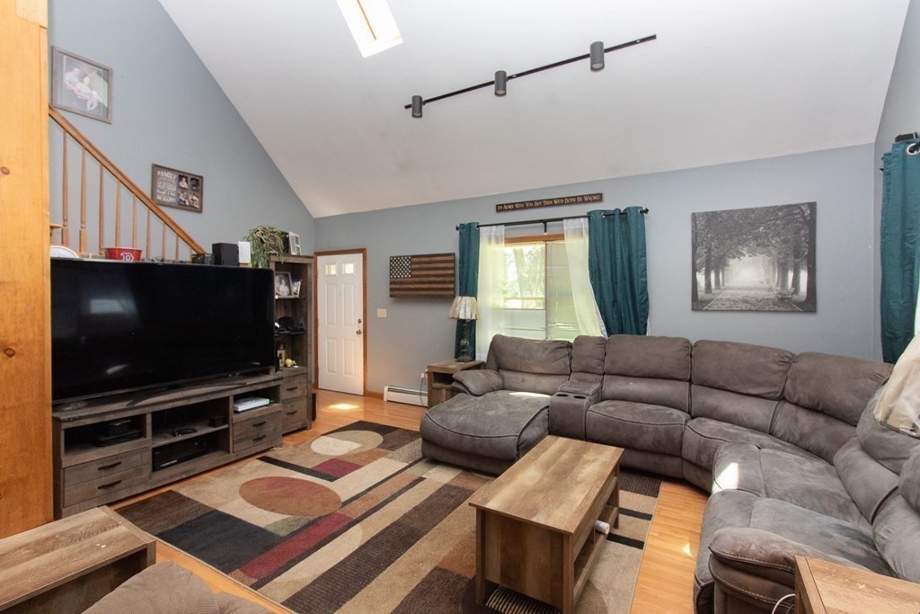 72 Bond Road Charlton, MA 01507 - Photo 4 of 36 a living room with furniture and a flat screen tv