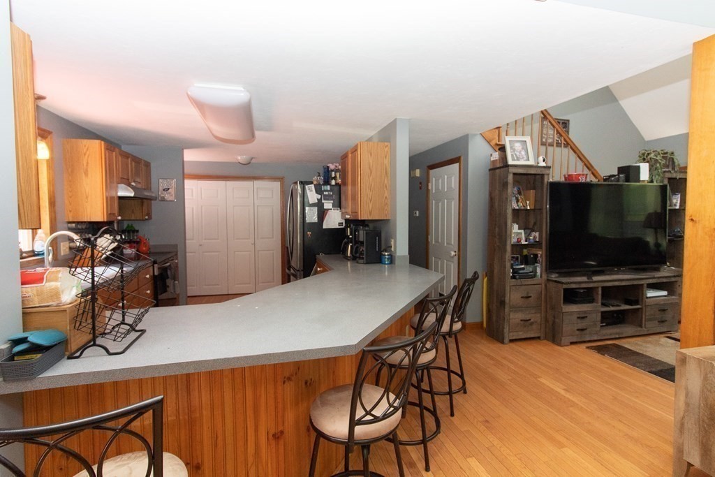 72 Bond Road Charlton, MA 01507 - Photo 8 of 36 a view of a dining room with furniture and wooden floor