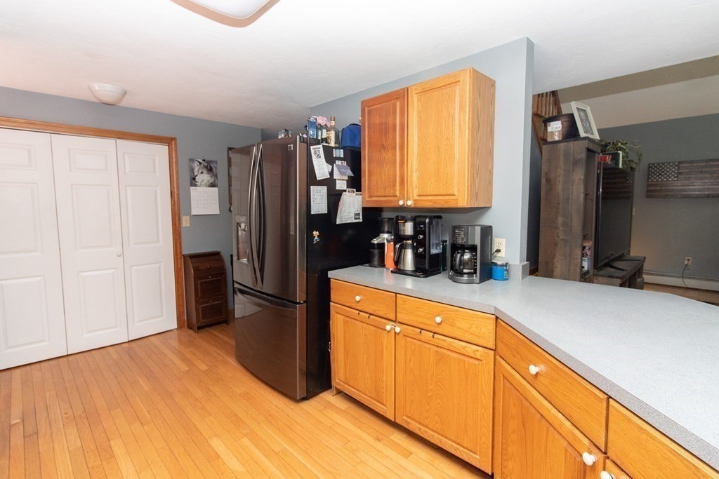 72 Bond Road Charlton, MA 01507 - Photo 10 of 36 a kitchen with stainless steel appliances a refrigerator sink and cabinets