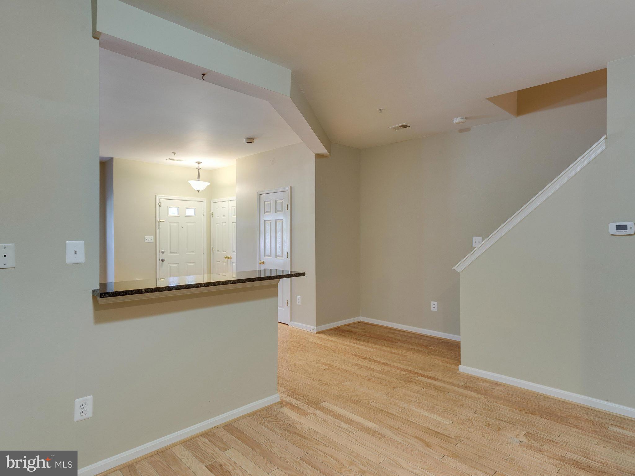 10613 Lockerbie Way Manassas, VA 20109 - Photo 11 of 27 a view of a kitchen cabinets and wooden floor