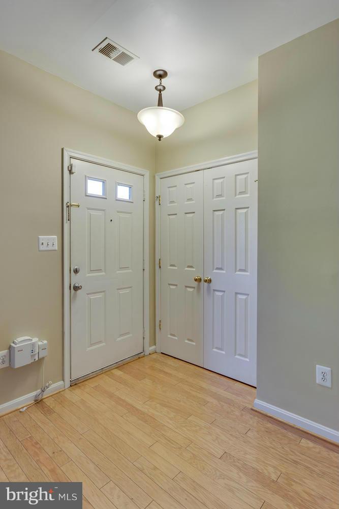10613 Lockerbie Way Manassas, VA 20109 - Photo 3 of 27 a view of a bathroom with a shower and a sink
