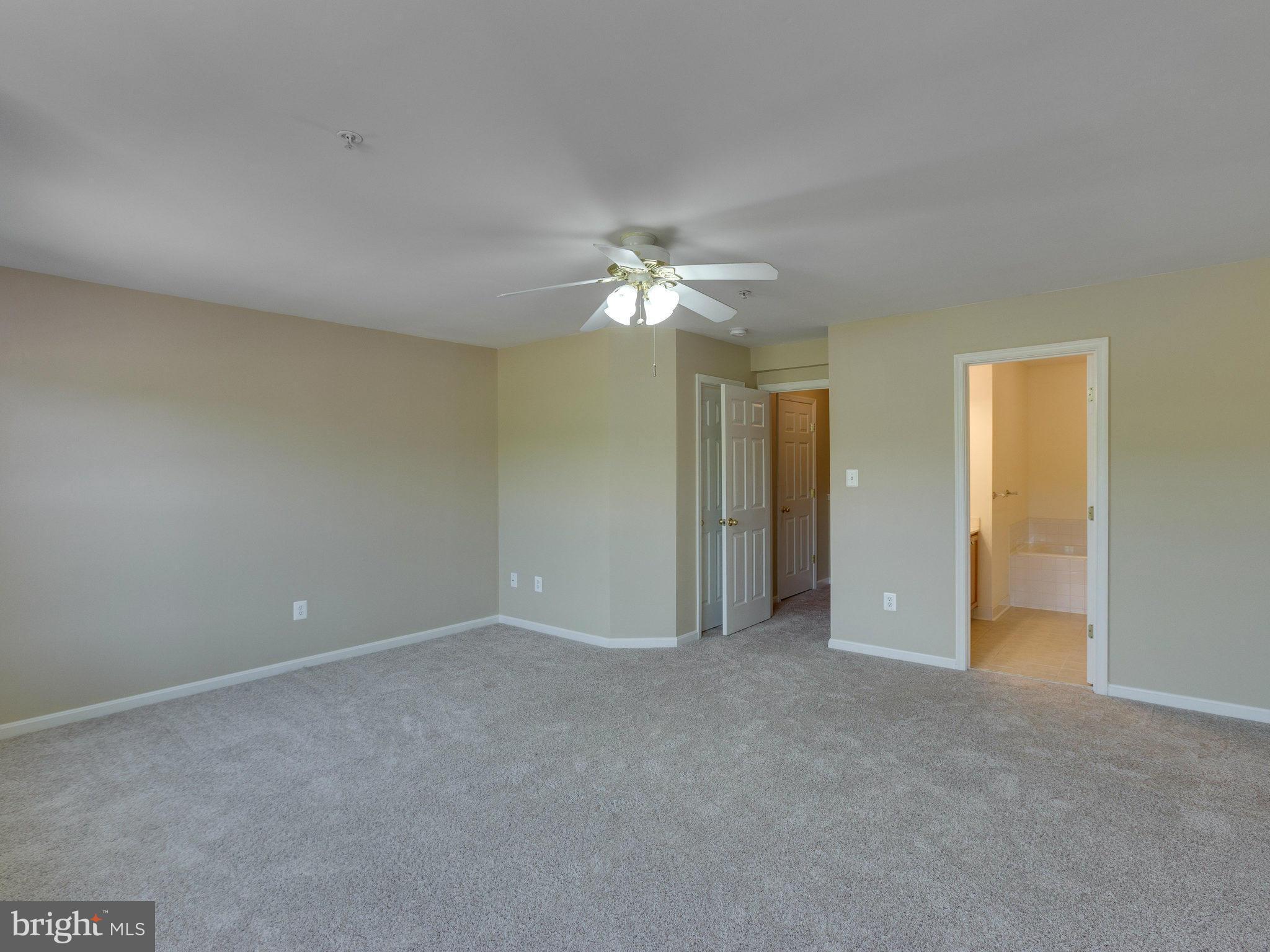10613 Lockerbie Way Manassas, VA 20109 - Photo 21 of 27 a view of an empty room with a ceiling fan