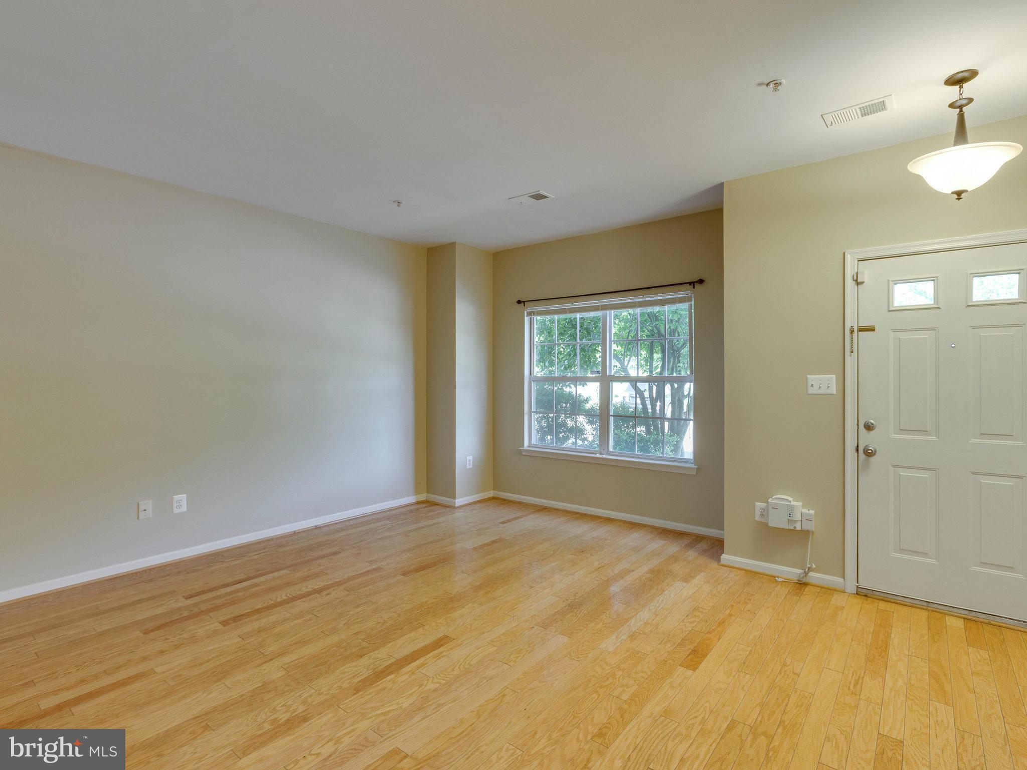 10613 Lockerbie Way Manassas, VA 20109 - Photo 5 of 27 a view of an empty room with a window