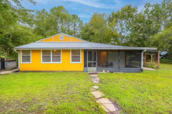 a house with swimming pool in front of it