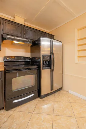 a view of a kitchen with a sink and cabinets