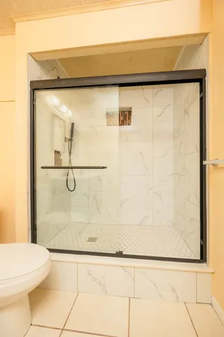 a bathroom with a sink vanity and mirror