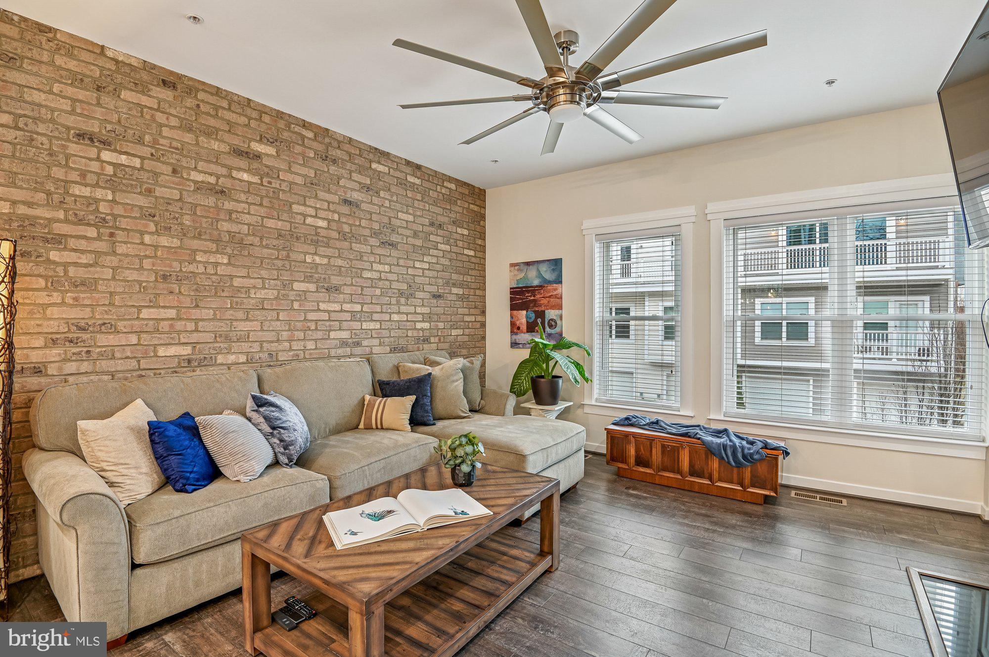 123 Lejeune Way Annapolis, MD 21401 - Photo 1 of 43 a living room with furniture and wooden floor
