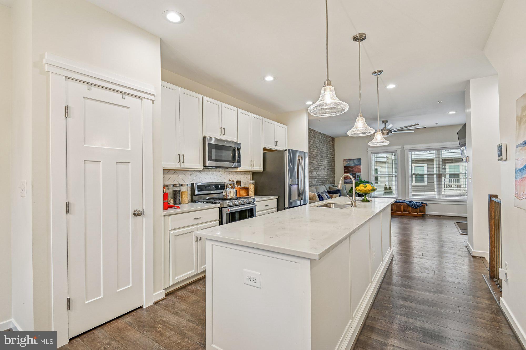123 Lejeune Way Annapolis, MD 21401 - Photo 12 of 43 a large white kitchen with stainless steel appliances