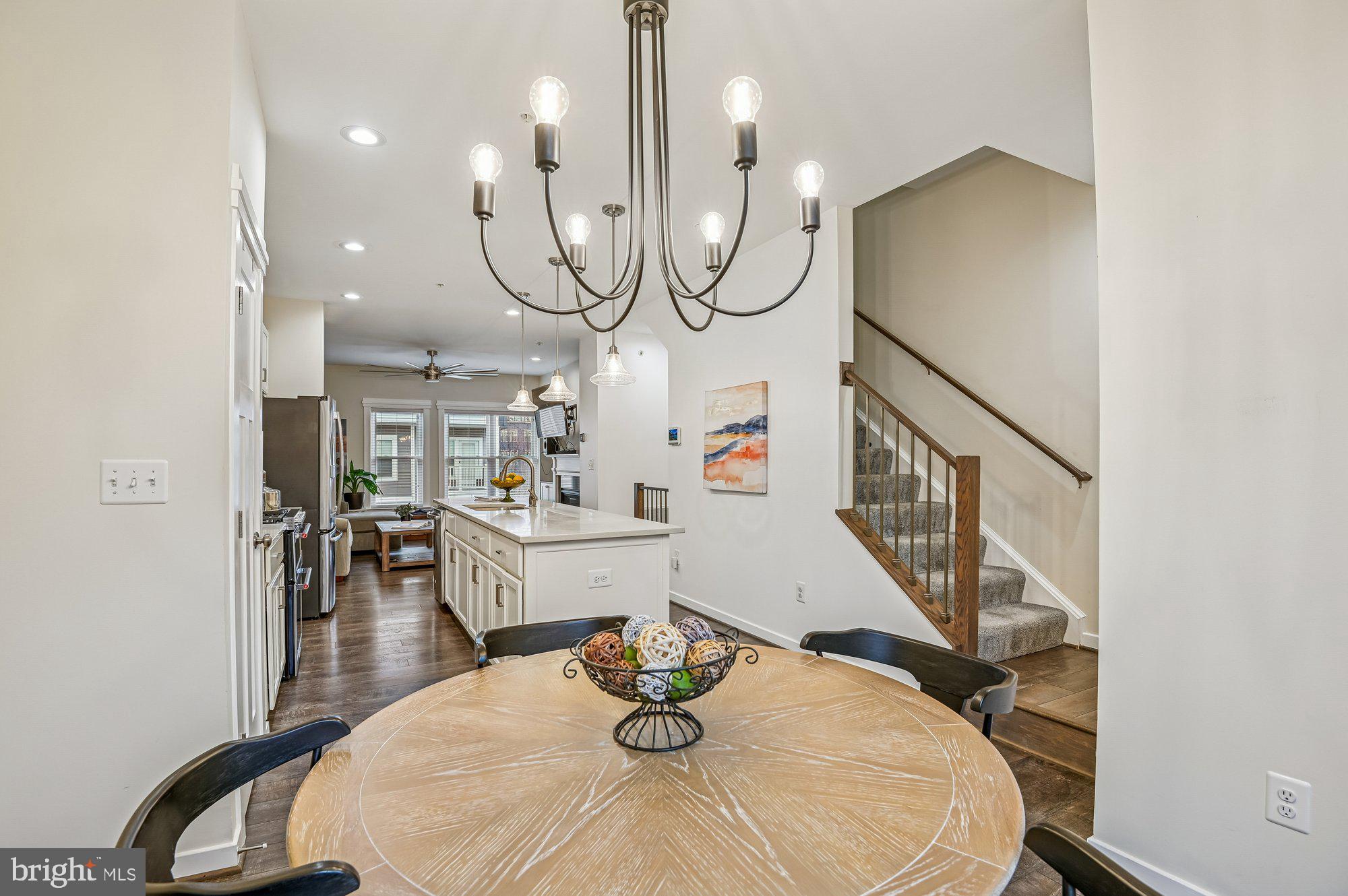 123 Lejeune Way Annapolis, MD 21401 - Photo 15 of 43 a view of dining room and hall with wooden floor