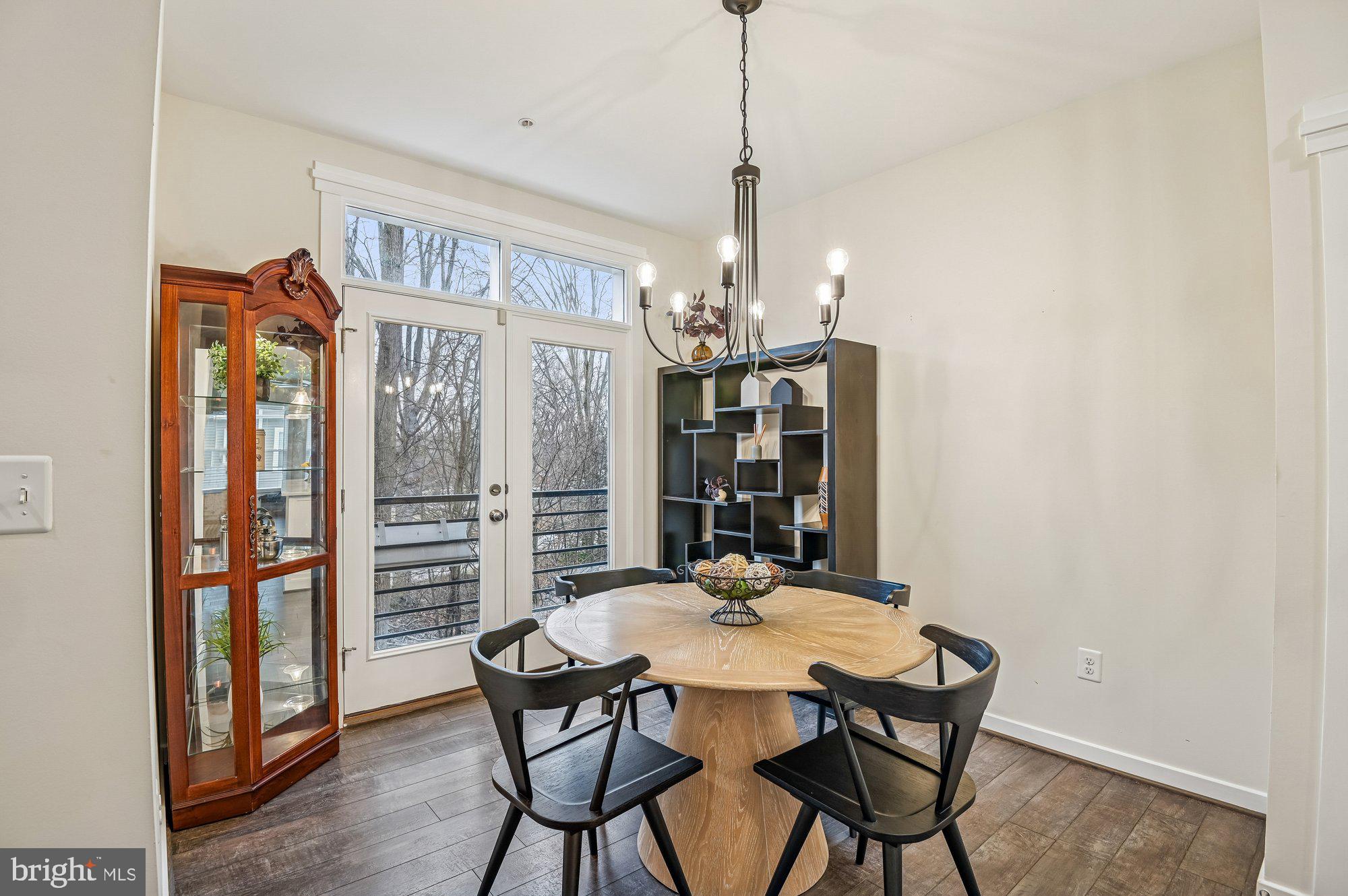 123 Lejeune Way Annapolis, MD 21401 - Photo 16 of 43 a view of a dining room with furniture window and wooden floor