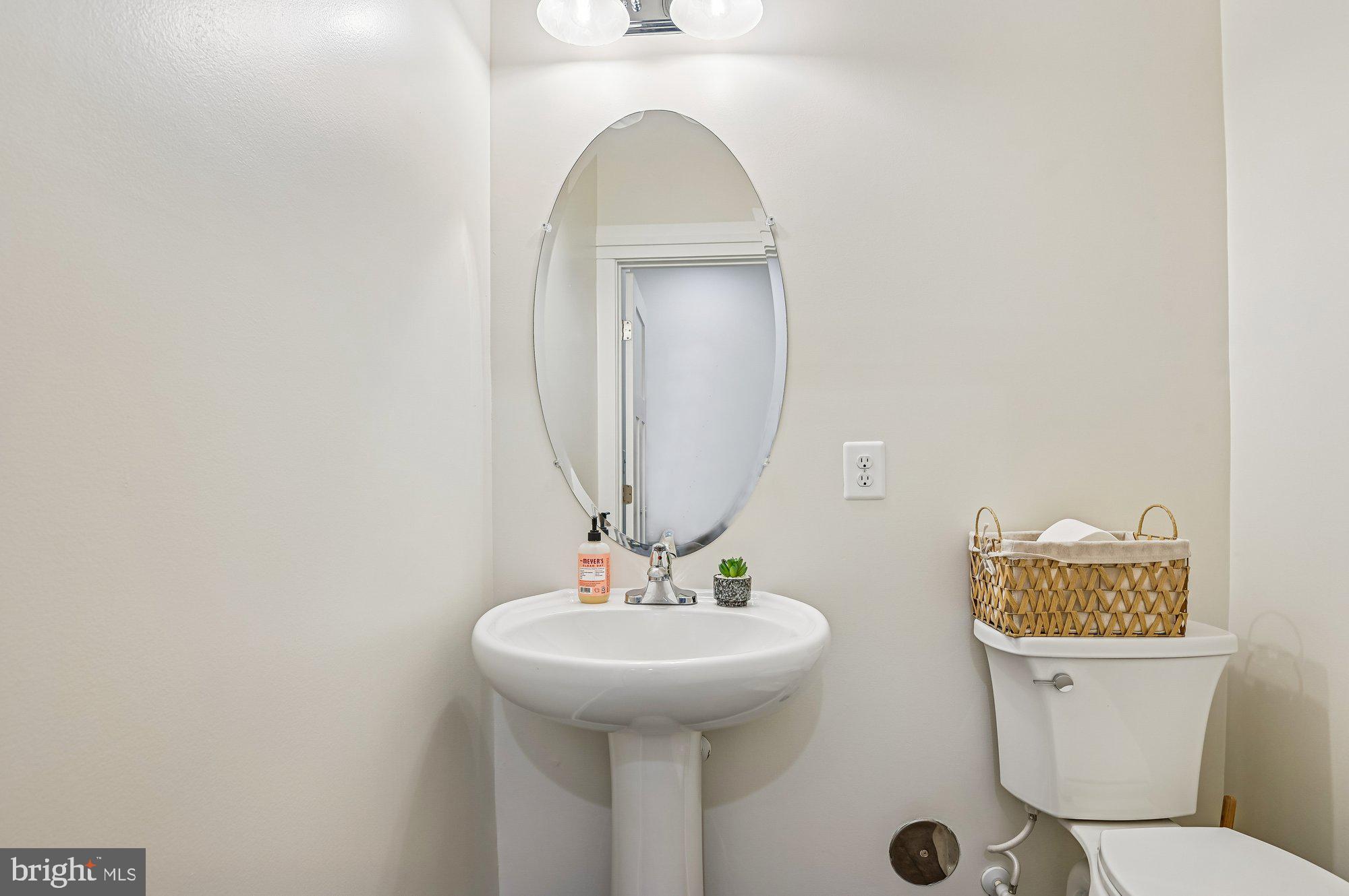 123 Lejeune Way Annapolis, MD 21401 - Photo 18 of 43 a bathroom with a toilet a sink and mirror