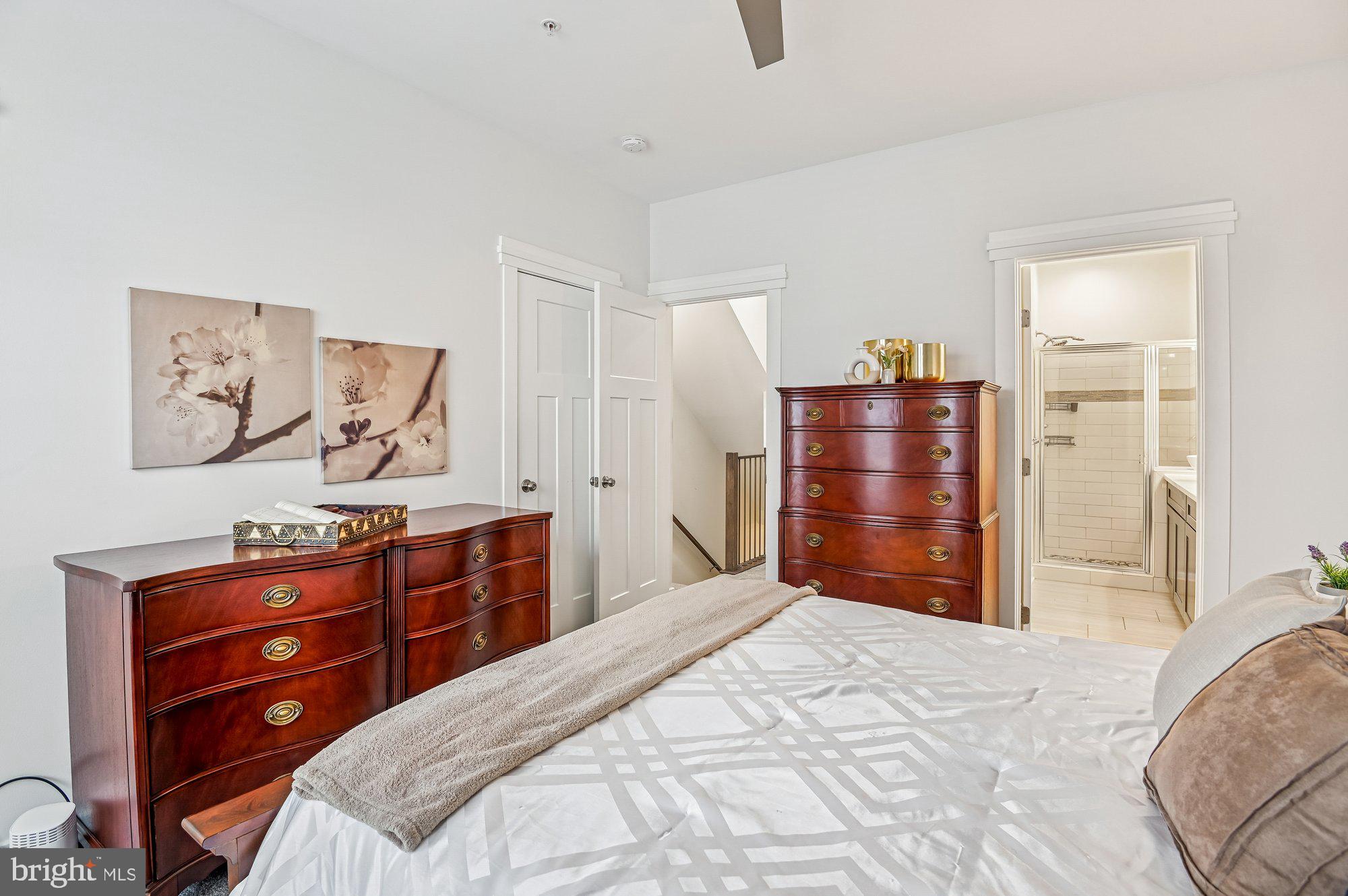 123 Lejeune Way Annapolis, MD 21401 - Photo 20 of 43 a bedroom with a bed and a dresser