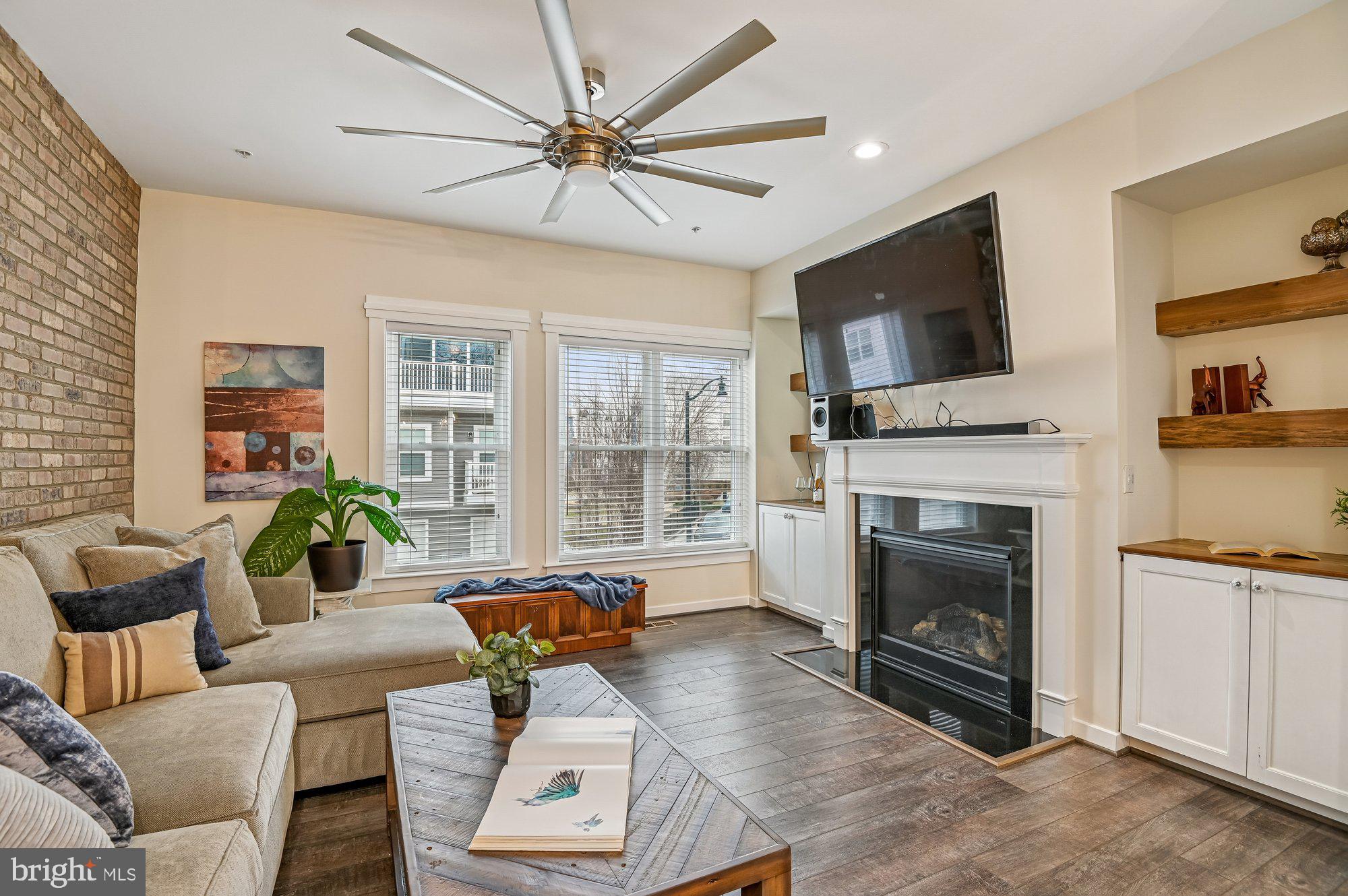 123 Lejeune Way Annapolis, MD 21401 - Photo 2 of 43 a living room with furniture a fireplace and a flat screen tv