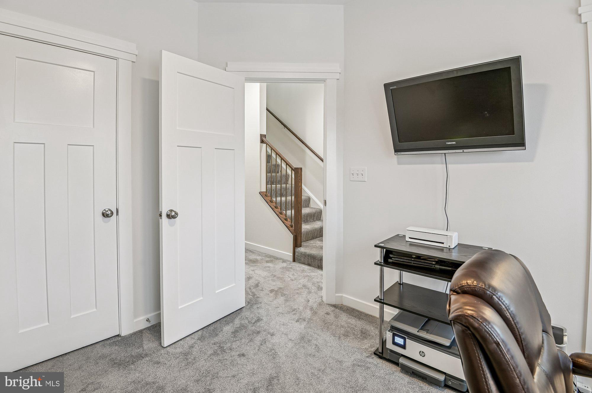 123 Lejeune Way Annapolis, MD 21401 - Photo 25 of 43 a room with furniture and a flat screen tv